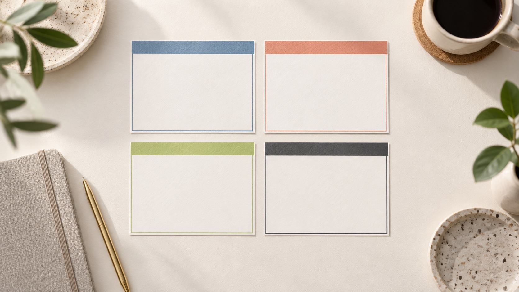 Four blank cards arranged in a prioritization matrix on a desk